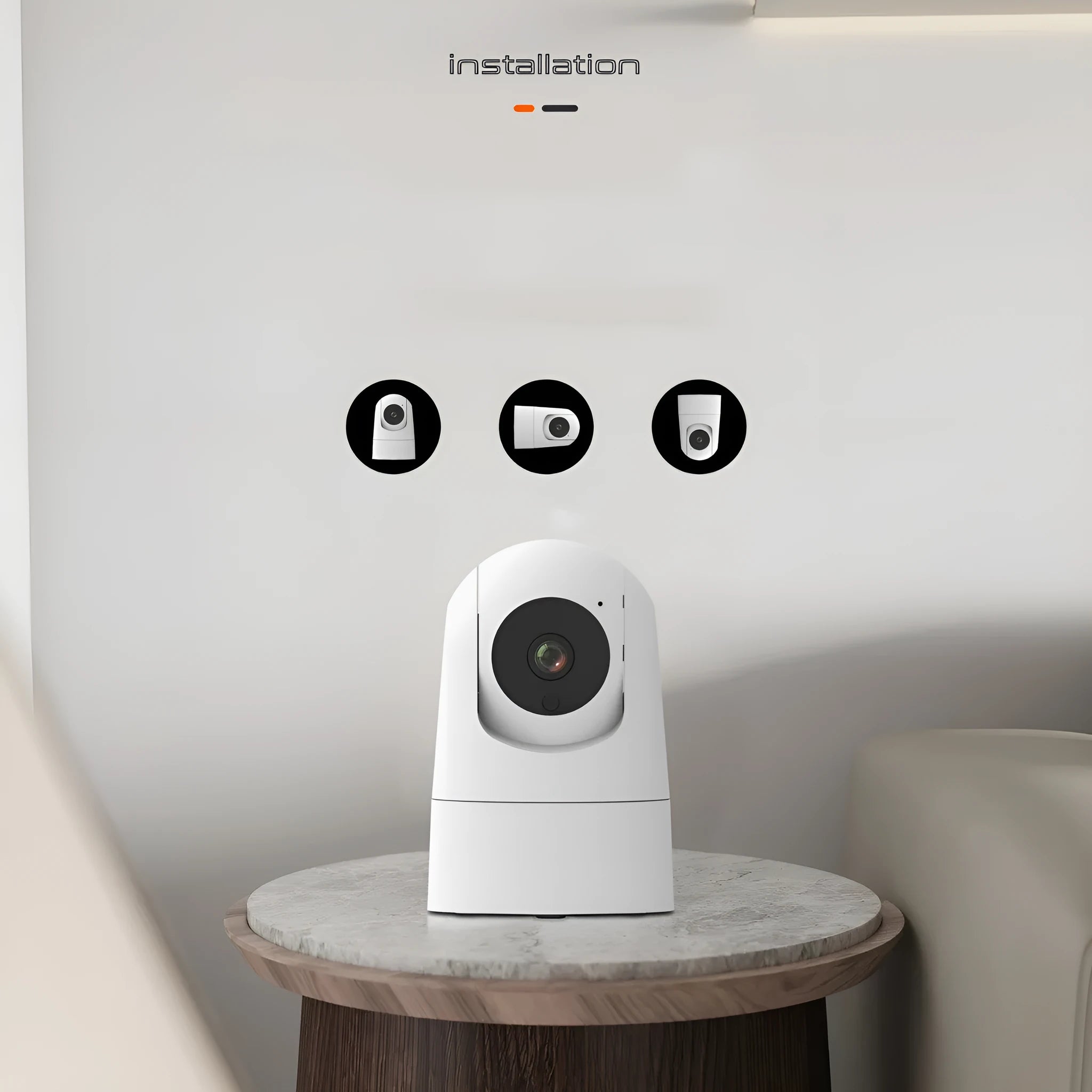 White indoor security camera with shake head function on a desk, showing UK plug.