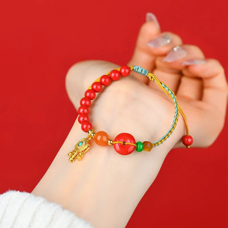 Women's cinnabar peace buckle bracelet in emperor red sand colour with hand-woven national style geometry design