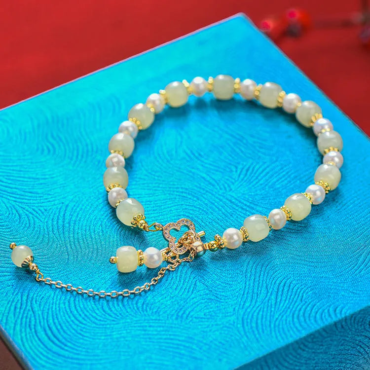 Women's Hetian jade bracelet with round pearl pendant and gold electroplated metal links