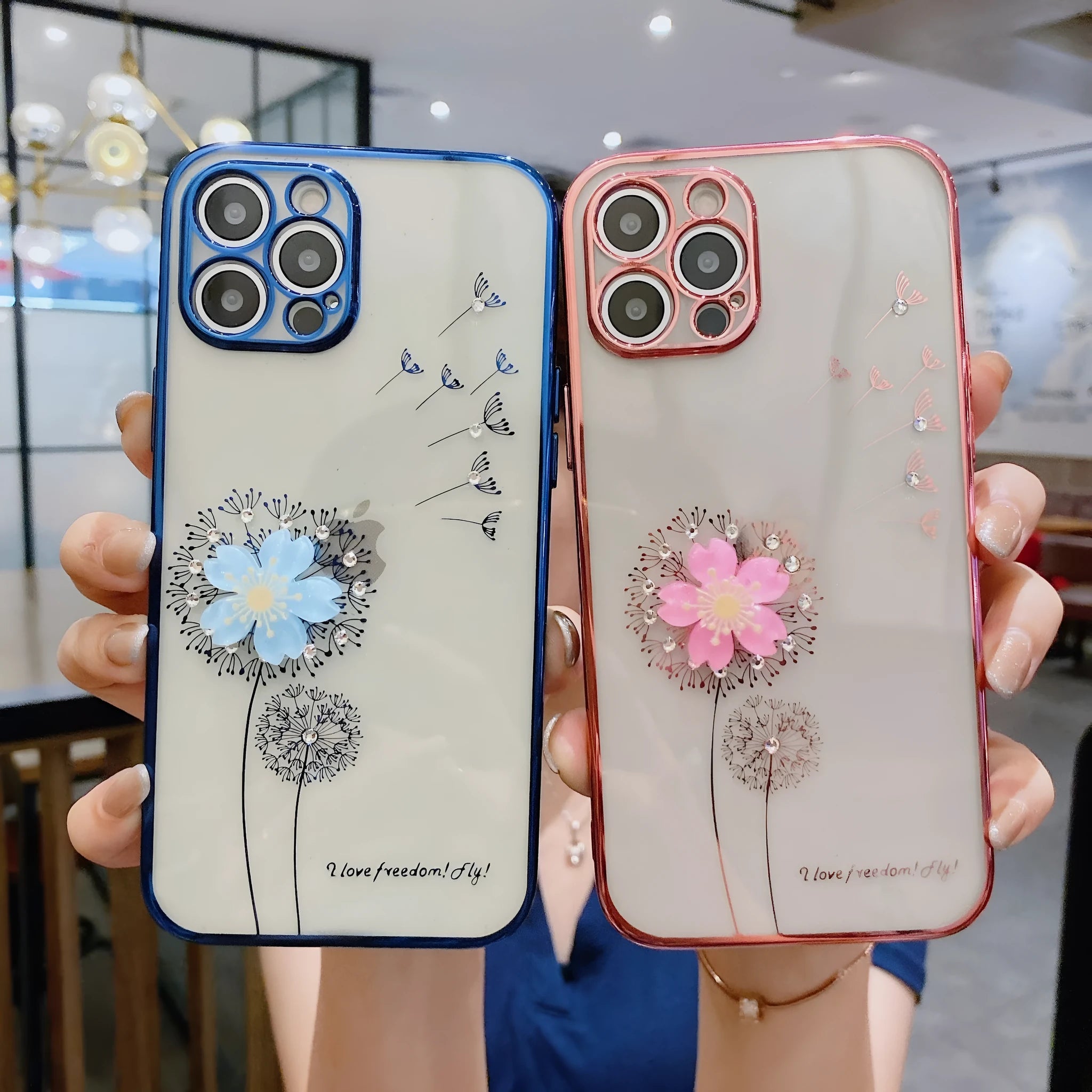 Purple silicone iPhone case with a 3D floral design and built-in spin stand on a table.
