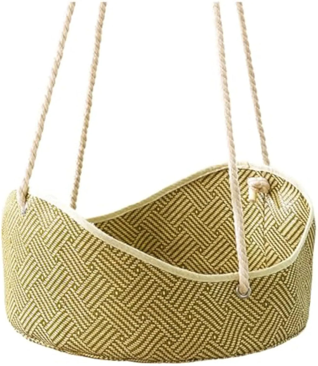 Green rattan cat hammock with metal hooks hanging on a white cage.