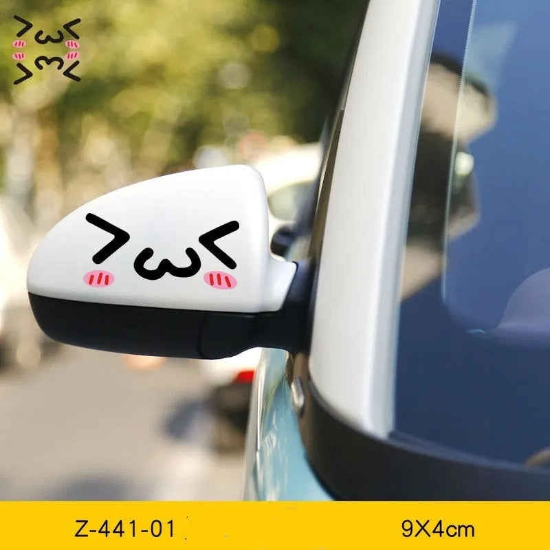 Pair of reflective cartoon car stickers with cute eye designs on a white background.