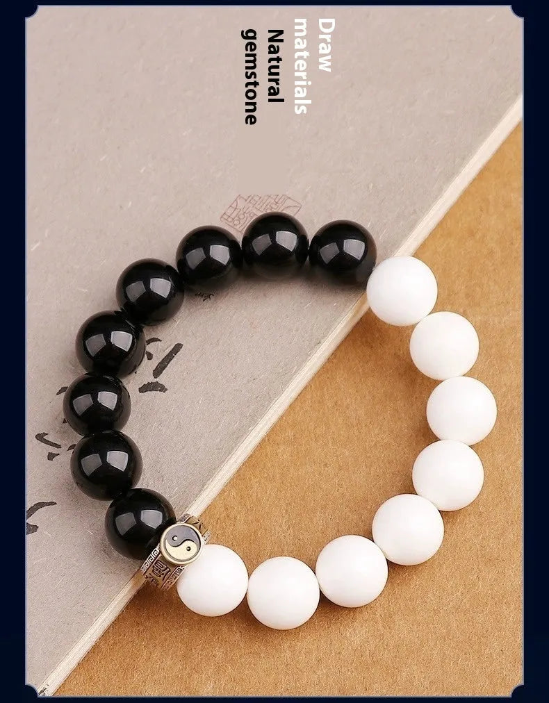 Black and white obsidian Tai Chi mantra bracelet with geometric woven beads