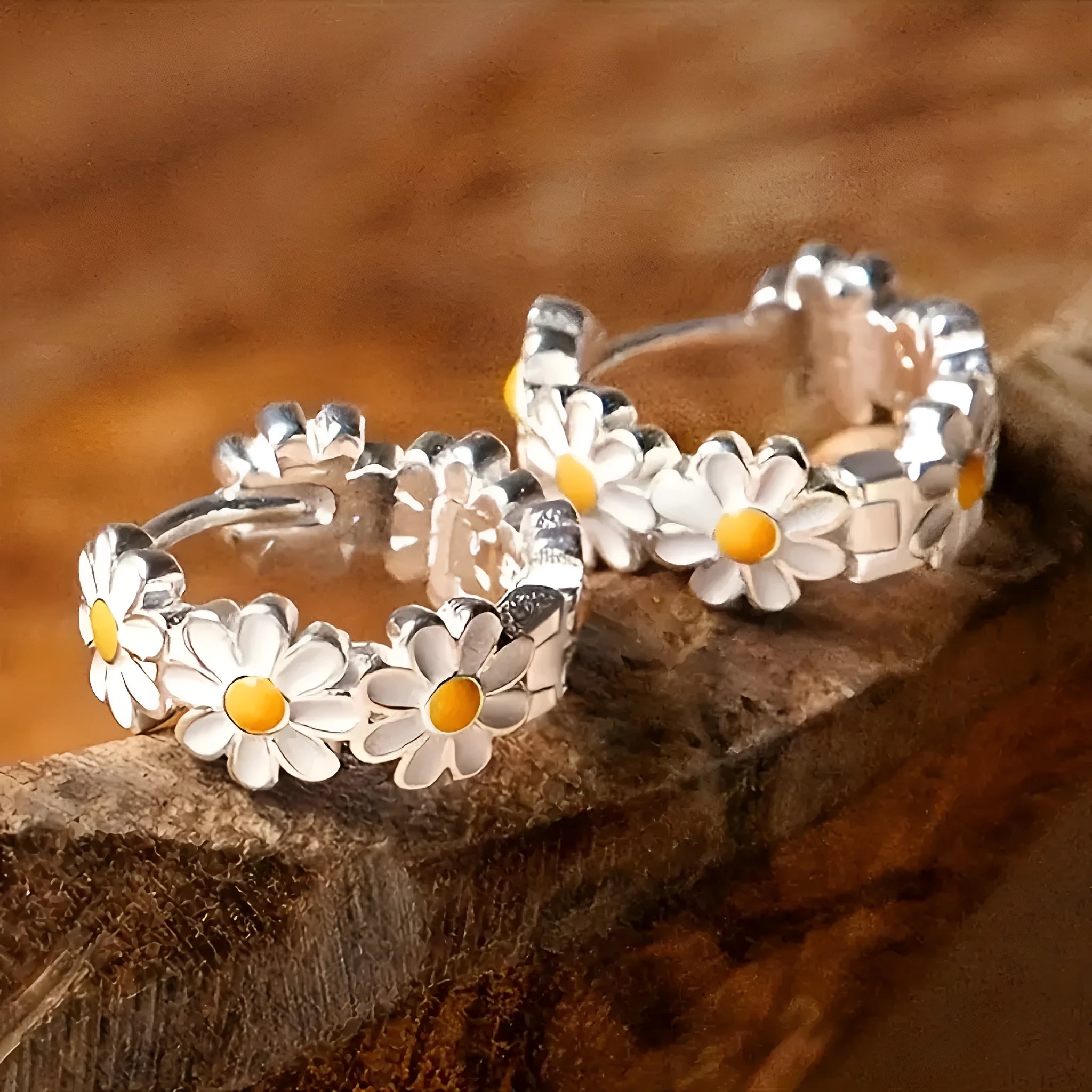 White daisy flower copper earrings with platinum gem accents on display