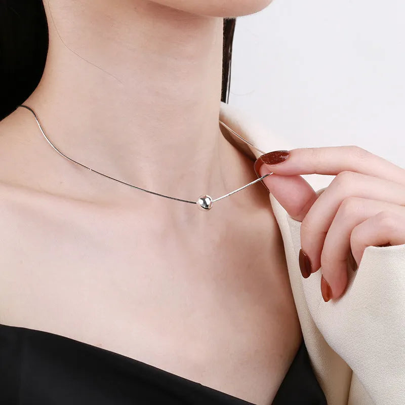 Sterling silver clavicle chain necklace with small ball pendant on delicate chain
