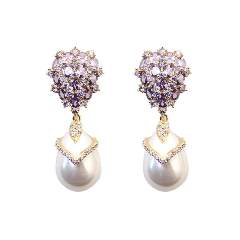 Women's drop-shaped earring with a white pearl and purple zircon stones on an 18K gold-plated setting.