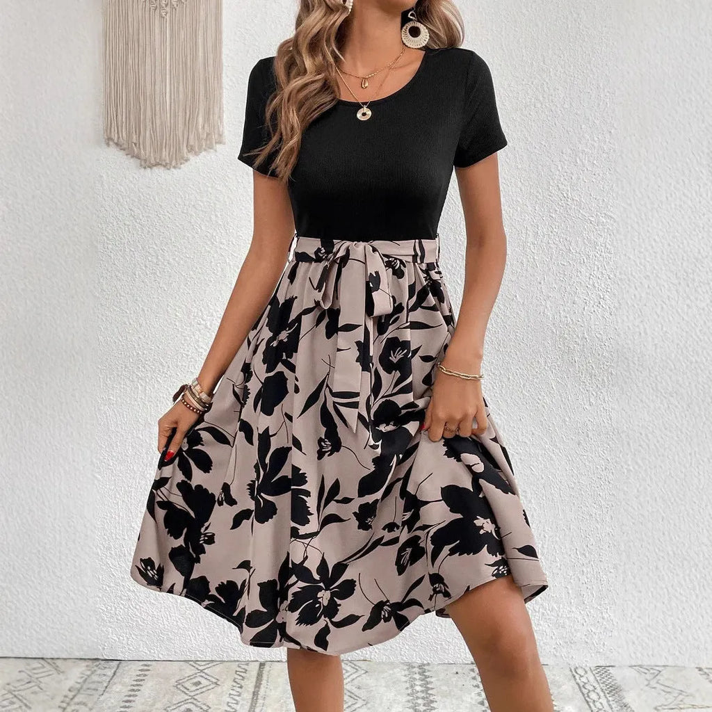 Khaki casual printed women's dress with A-line skirt, shoulder straps, and front lace-up detail.