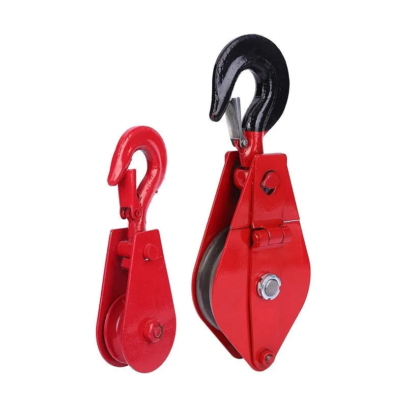 Red industrial lifting pulley with a safety latch, forged from steel for heavy-duty use.