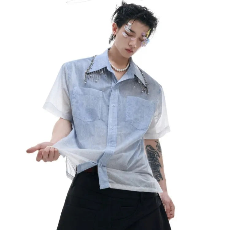 Blue and white gradient short-sleeved loose fit shirt on a hanger.