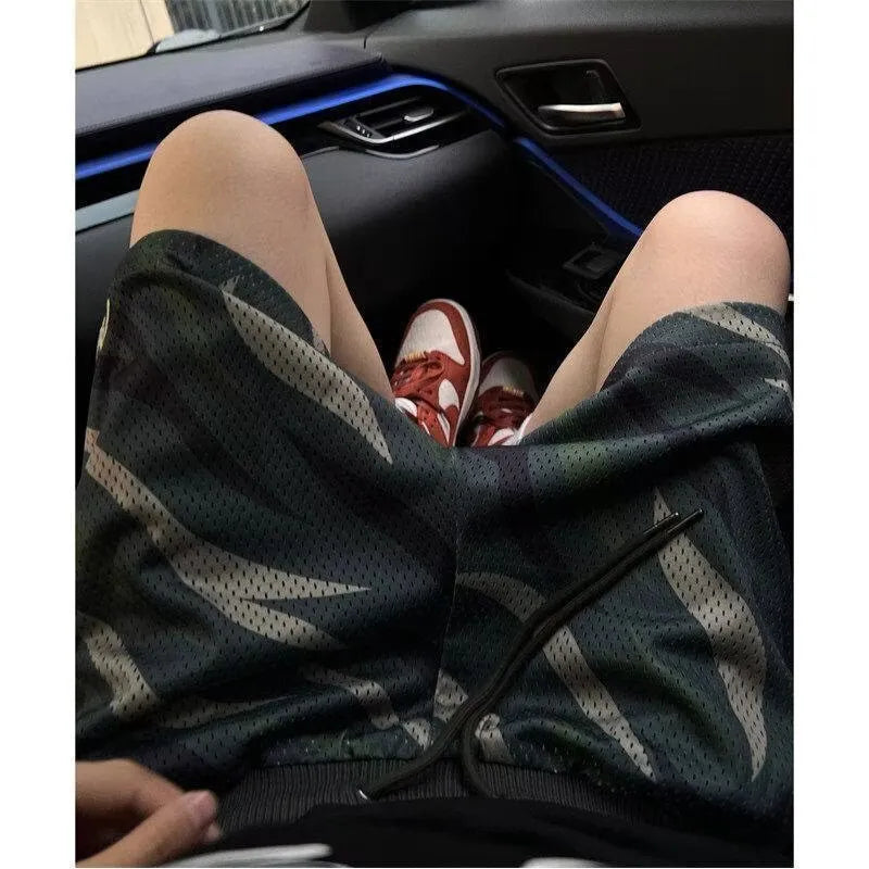 Men's camouflage mesh shorts in cotton blend fabric with straight cut design