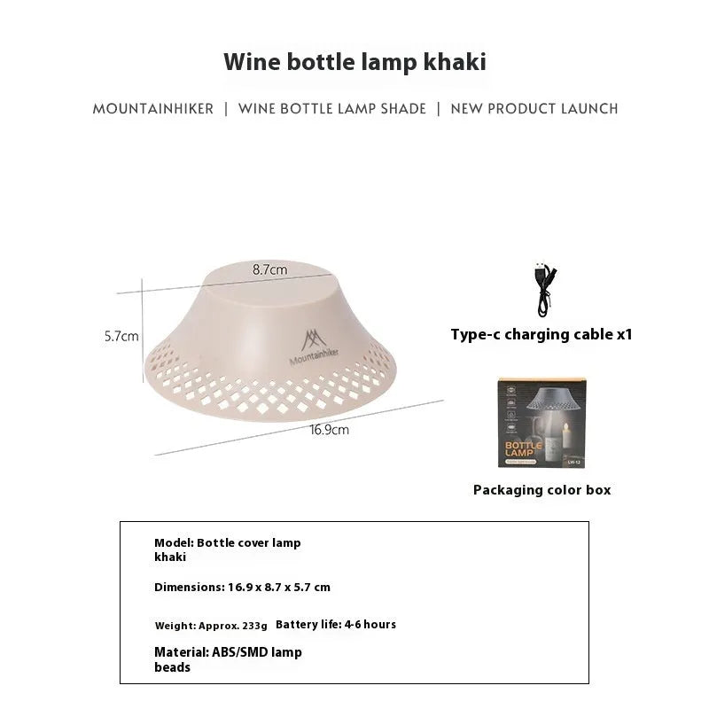 Beige and grey portable camping lantern with a wine bottle shaped lampshade and USB-C charging port.