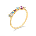 Gold-plated geometric ring with inlaid topaz and white amethyst stones on a white background