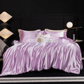 Personalised solid colour silk bed sheet four-piece set shown in multiple colour options.