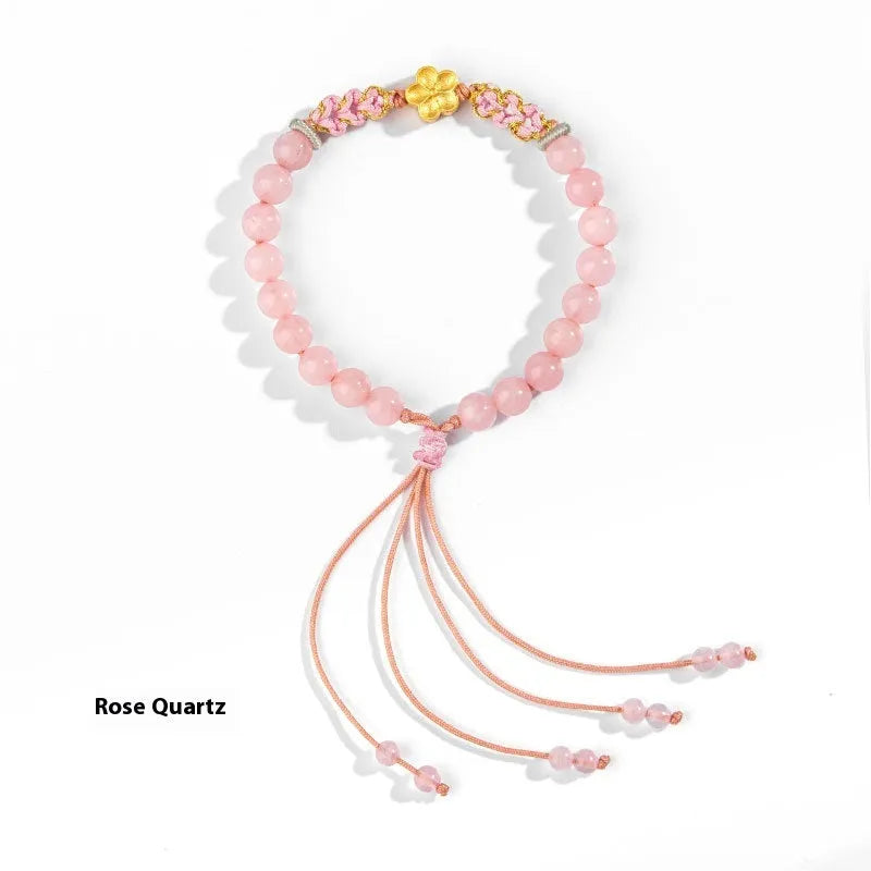 Hand-woven natural rope bracelet with diamond crystal charm in Chinese peach blossom style