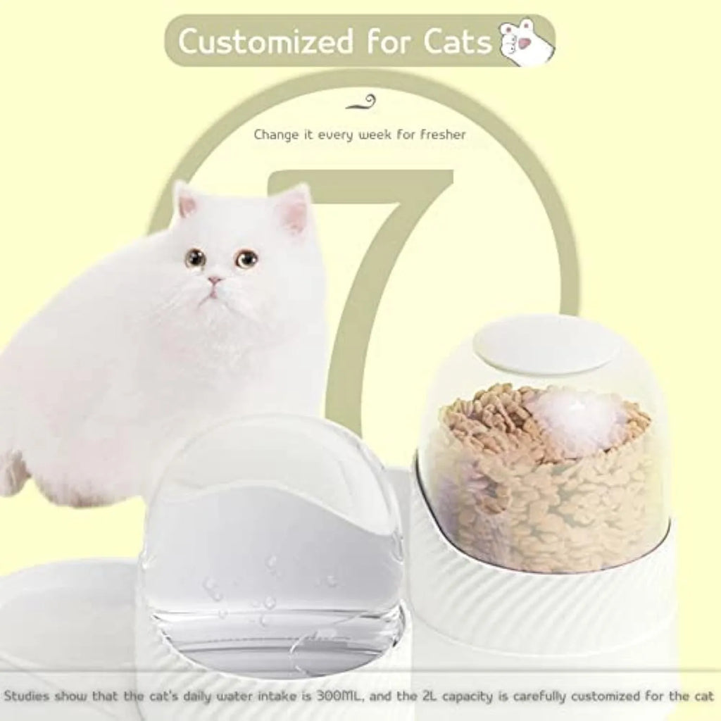 White gravity-fed cat feeder and water dispenser set with wave-shaped design on a table.