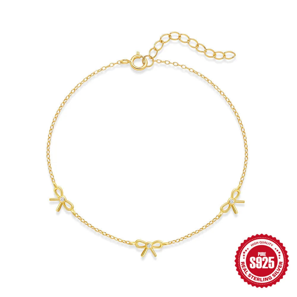 S925 sterling silver bow pendant ear bone stud bracelet necklace jewellery set with gold electroplated finish on O-shaped chain