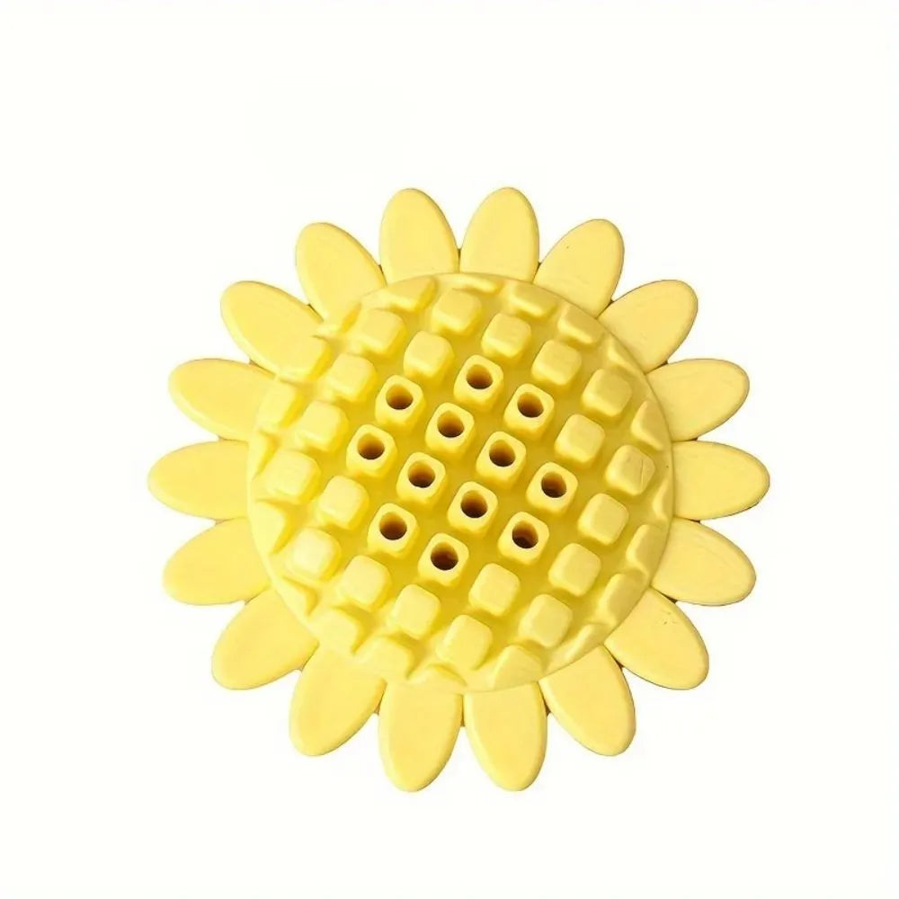 Yellow rubber sunflower-shaped dog chew toy measuring 7 cm across with textured petal surface
