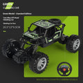 Children's four-way remote control alloy off-road climbing car in camouflage yellow on a grassy outdoor track
