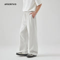 Men's grey high-waisted casual trousers with a lace-up front detail on a plain background.