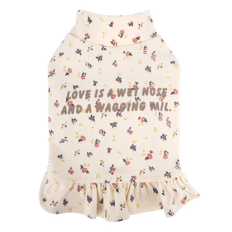 Bichon Frise dog wearing light purple floral undershirt skirt pet clothing