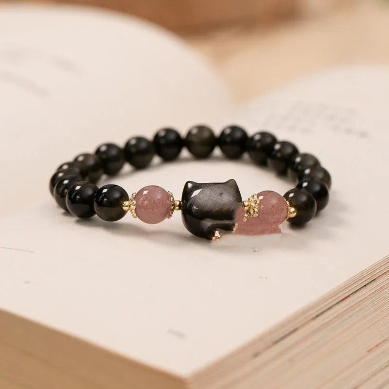 Black obsidian bracelet with 8mm beads and silver cat charms on stretch cord