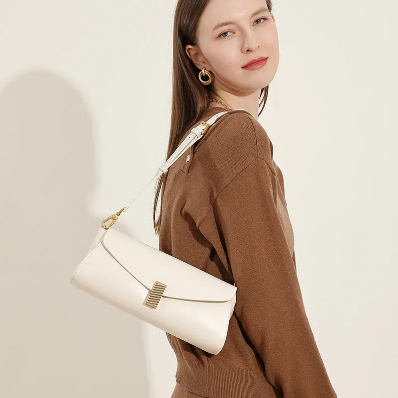 Women's cowhide leather cross-body bag in pillow shape with clamshell opening