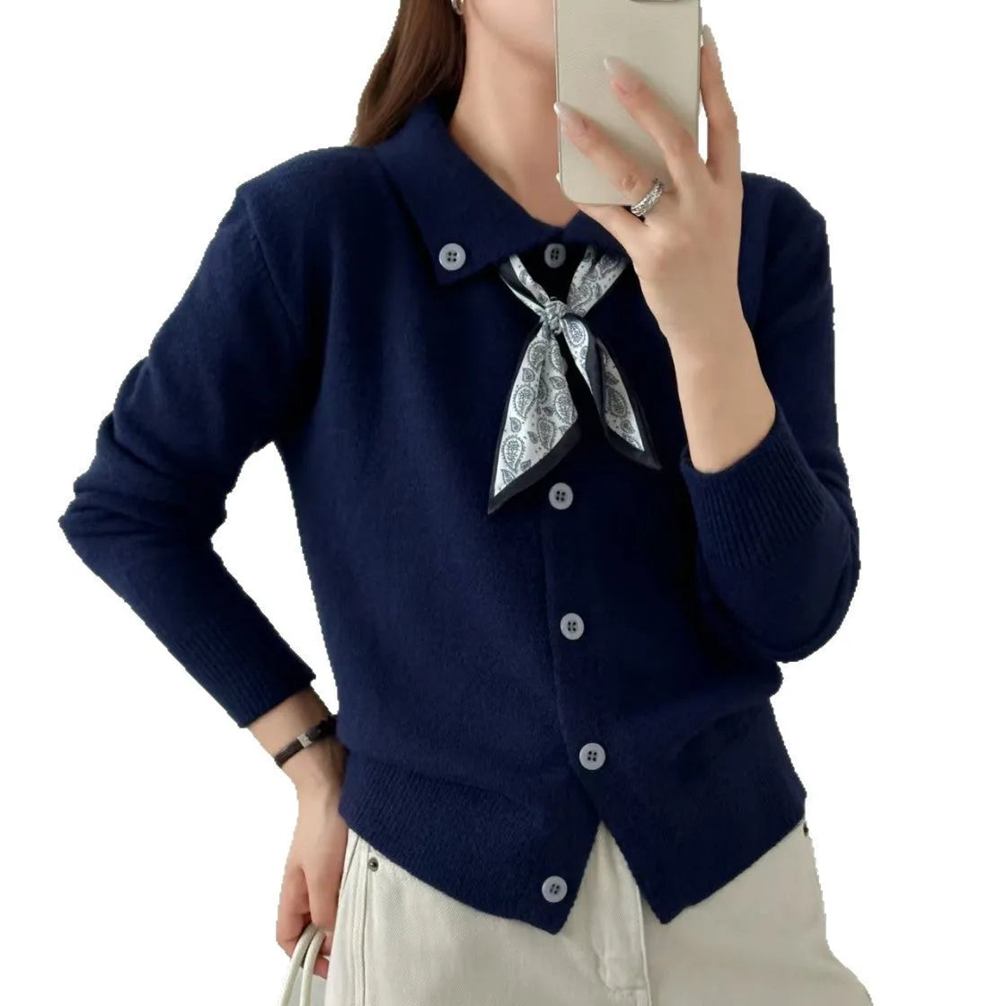 Acrylic fibre lazy fashion cardigan sweater with integrated lapel scarf in a neutral colour.