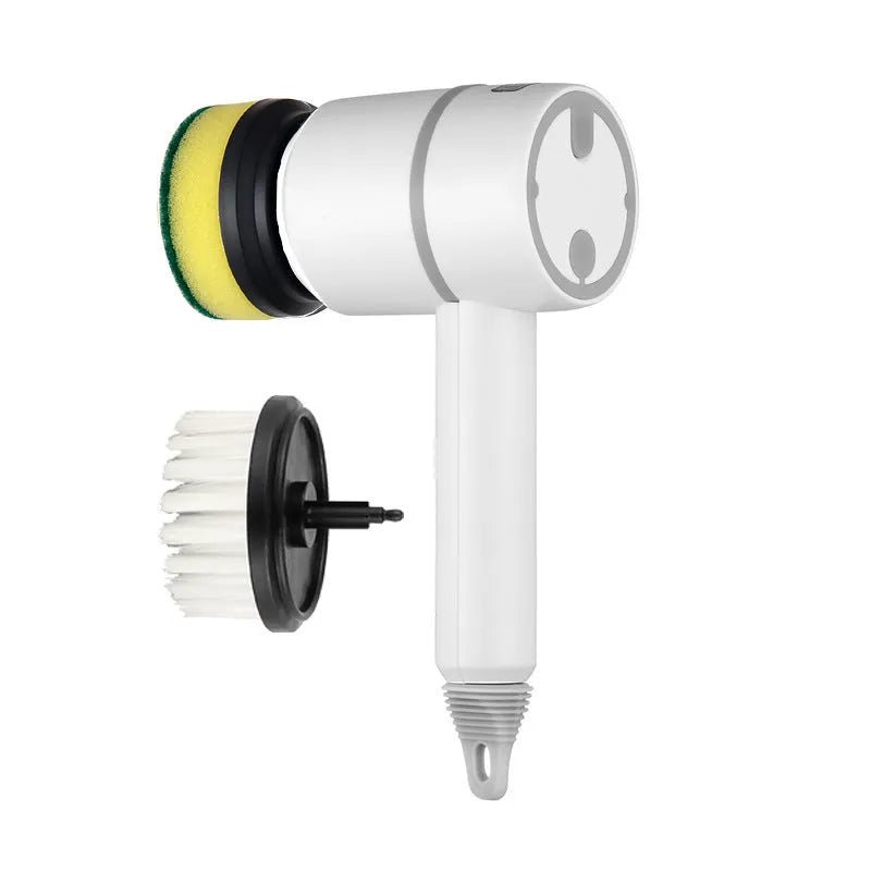 White rechargeable electric cleaning brush with multiple scrubber heads on a kitchen worktop.