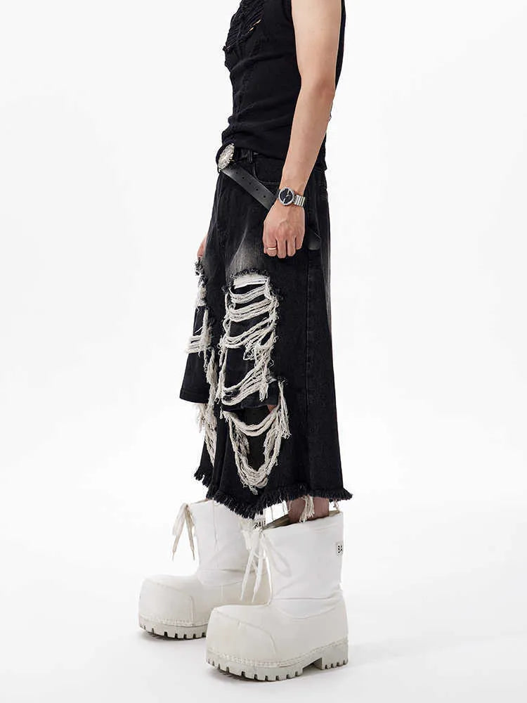 Black cropped wide-leg jeans with mid-high waist and distressed patch detail on micro-elastic denim