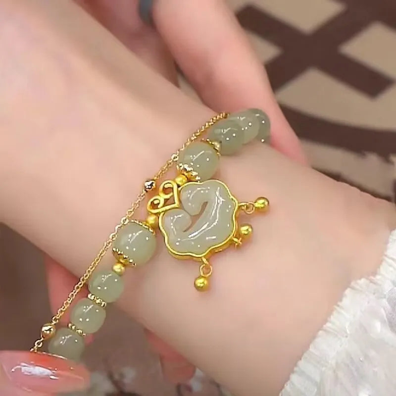 Women's green safety lock bell pendant bracelet with double-layer design and electroplated finish