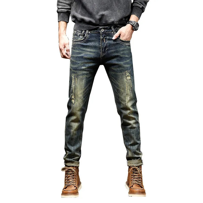 Men's skinny fit jeans in a retro blue wash with a zip fly closure.