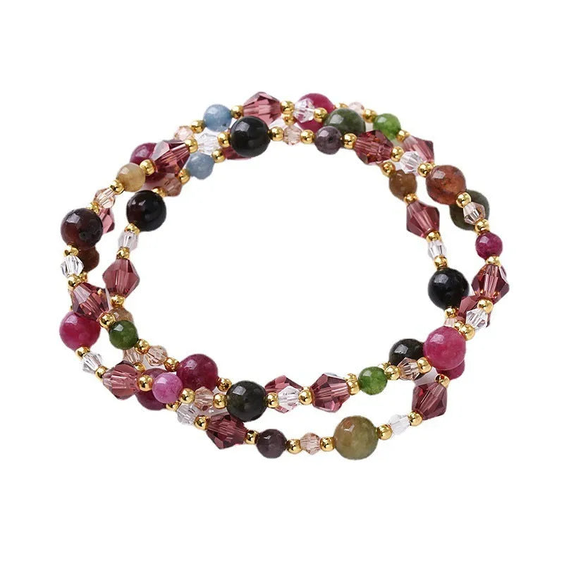 Women's adjustable three-ring bracelet with tourmaline, strawberry quartz and amethyst crystals on cord