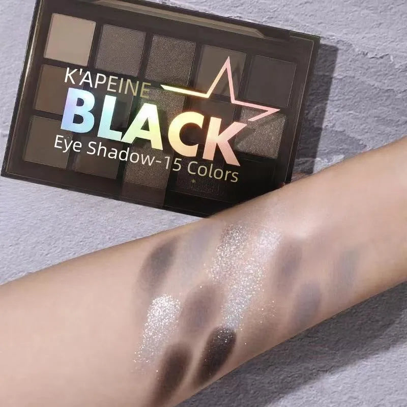 15-colour eye shadow palette with earthy tones and cartoon designs showing shimmer matte finishes