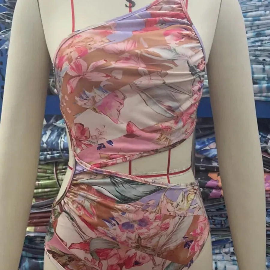 Women's rose gold pattern swimsuit made from polyester fabric available in multiple sizes
