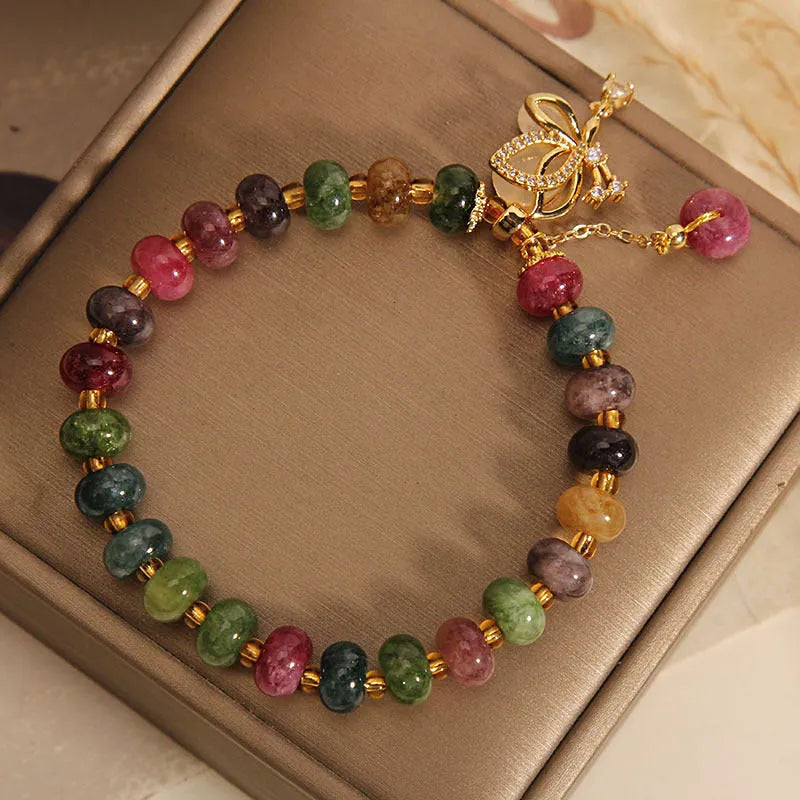 Colourful women's butterfly bracelet with tourmaline beads on alloy construction
