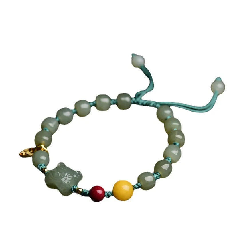 Natural Hetian Jade bracelet with cinnabar and beeswax beads, showing Zodiac modelling on 5x7mm beads.