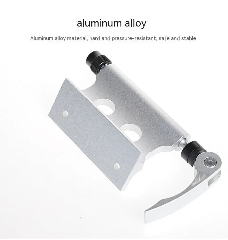 Silver metal quick-release clamp for securing a bicycle front fork during transport.