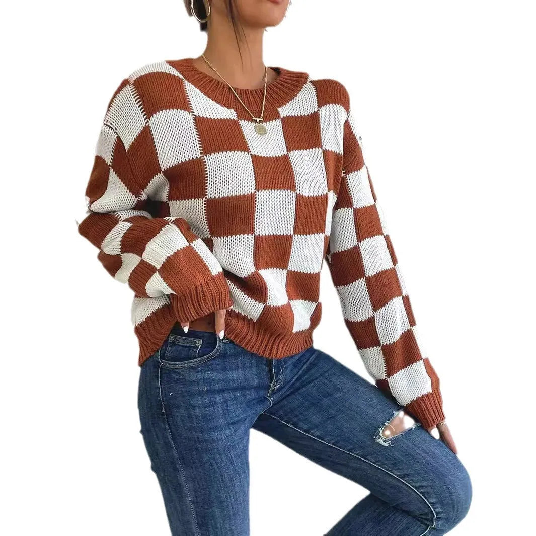 Dark brown loose plaid pullover sweater with a chessboard pattern and long sleeves.