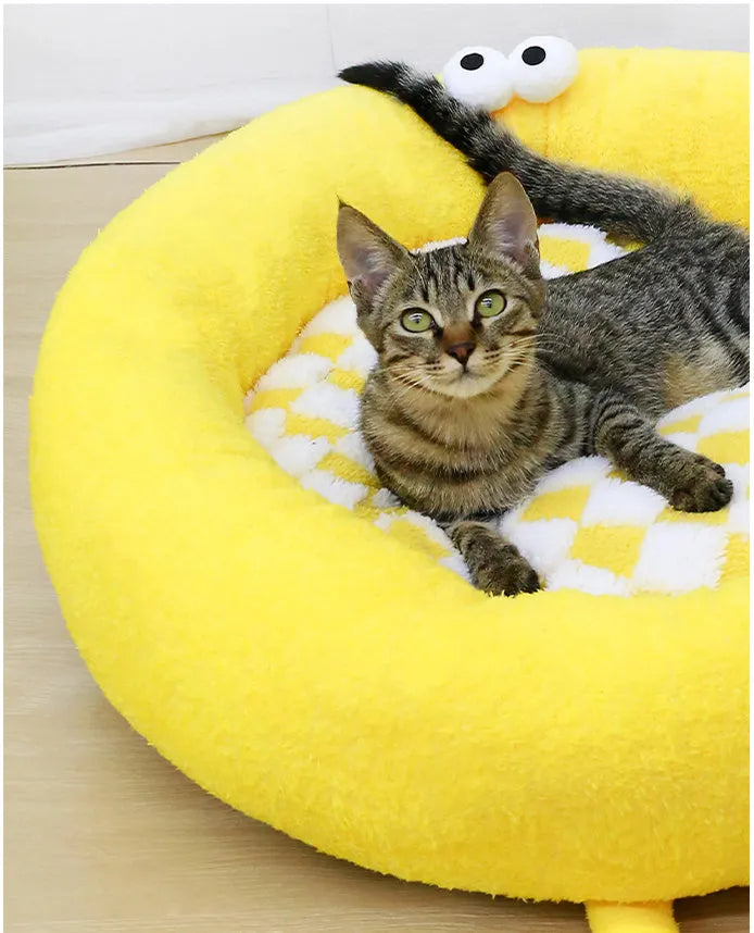 A plush, thick nest-style dog bed for small to medium sized pets, shown in yellow, pink, or black.