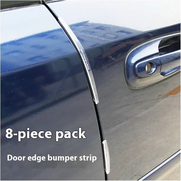 Solid white plastic car door edge anti-collision strip on a vehicle door.