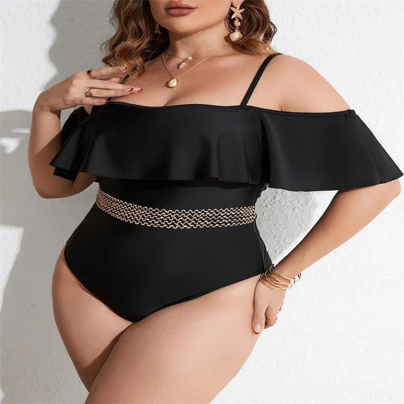 Black solid colour women's one-piece polyester swimsuit on a hanger.