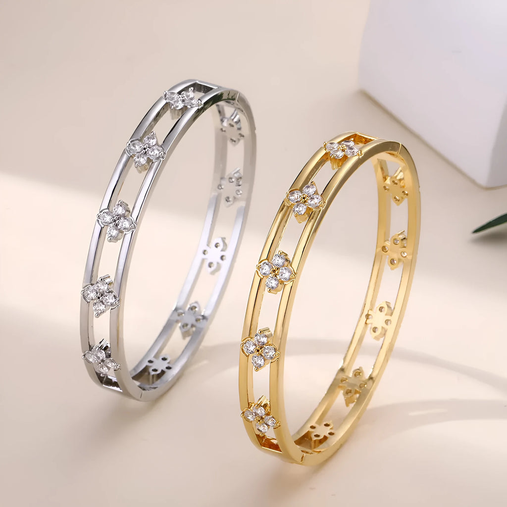 Hollow women's bracelet with four-leaf clover charm and zircon detail in gold or silver finish