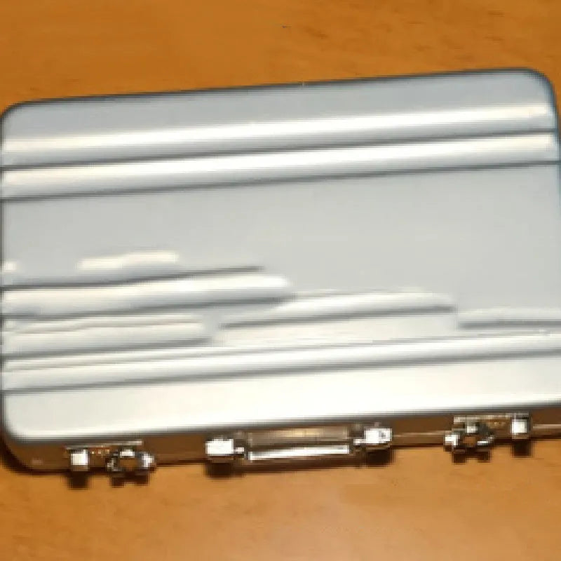 Slim aluminium alloy card holder in six colour options showing its compact size.