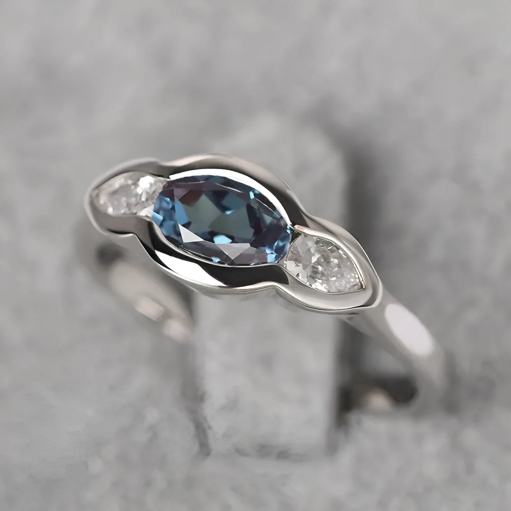 Geometric ellipse women's ring with zircon inlay in white gold finish, showing sizes 6 to 10