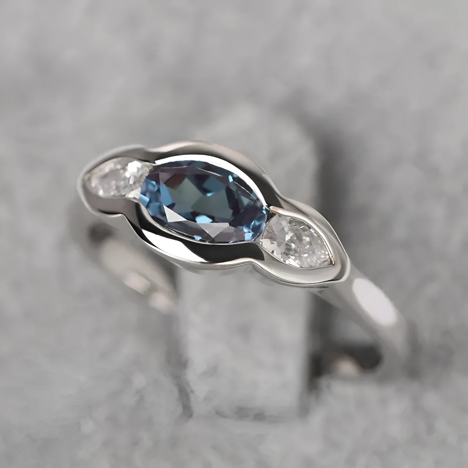 Geometric ellipse women's ring with zircon inlay in white gold finish, showing sizes 6 to 10