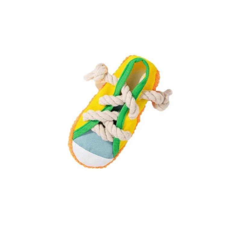 Yellow plastic dog slipper toy with a squeaker for chewing.