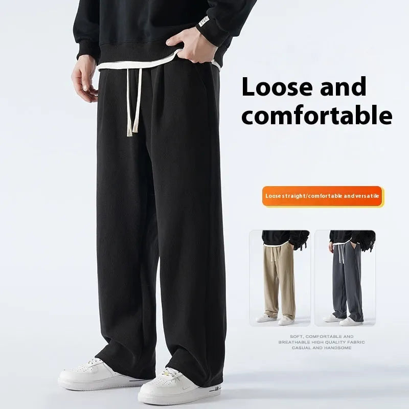 Man wearing apricot coloured loose-fit polar fleece winter sports pants with a drawstring waist.