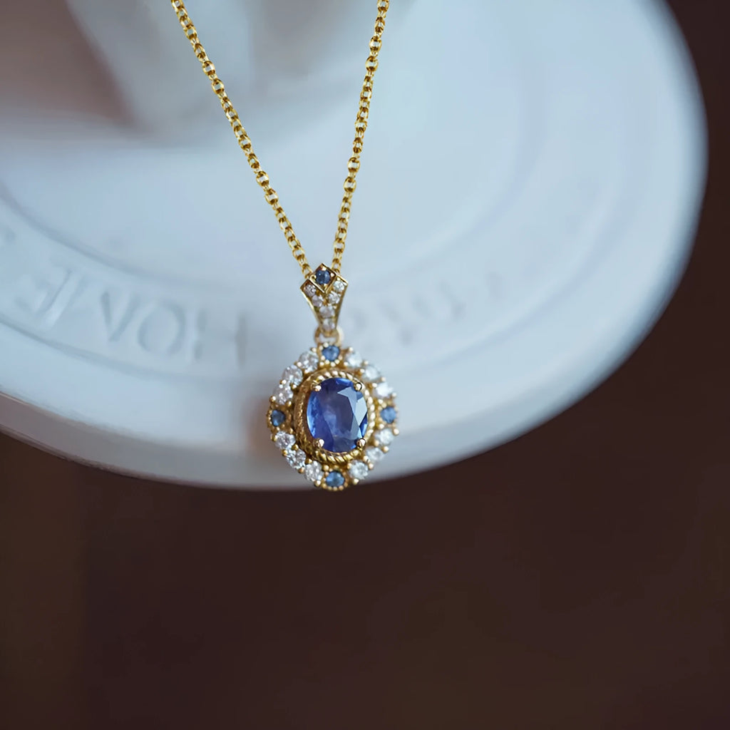 Golden royal necklace with mixed gemstone pendant on a box chain, adjustable length.