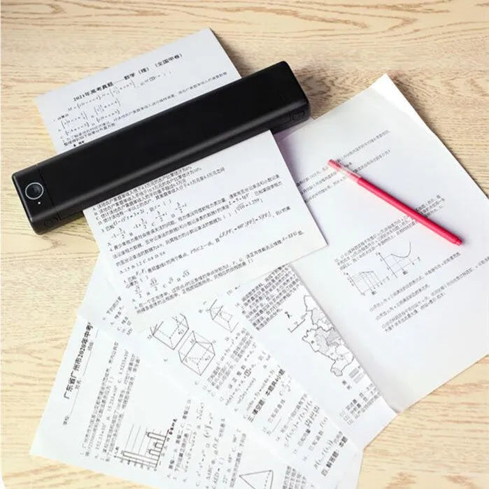 Phomemo M08F white portable A4 thermal printer with charging cable on desk