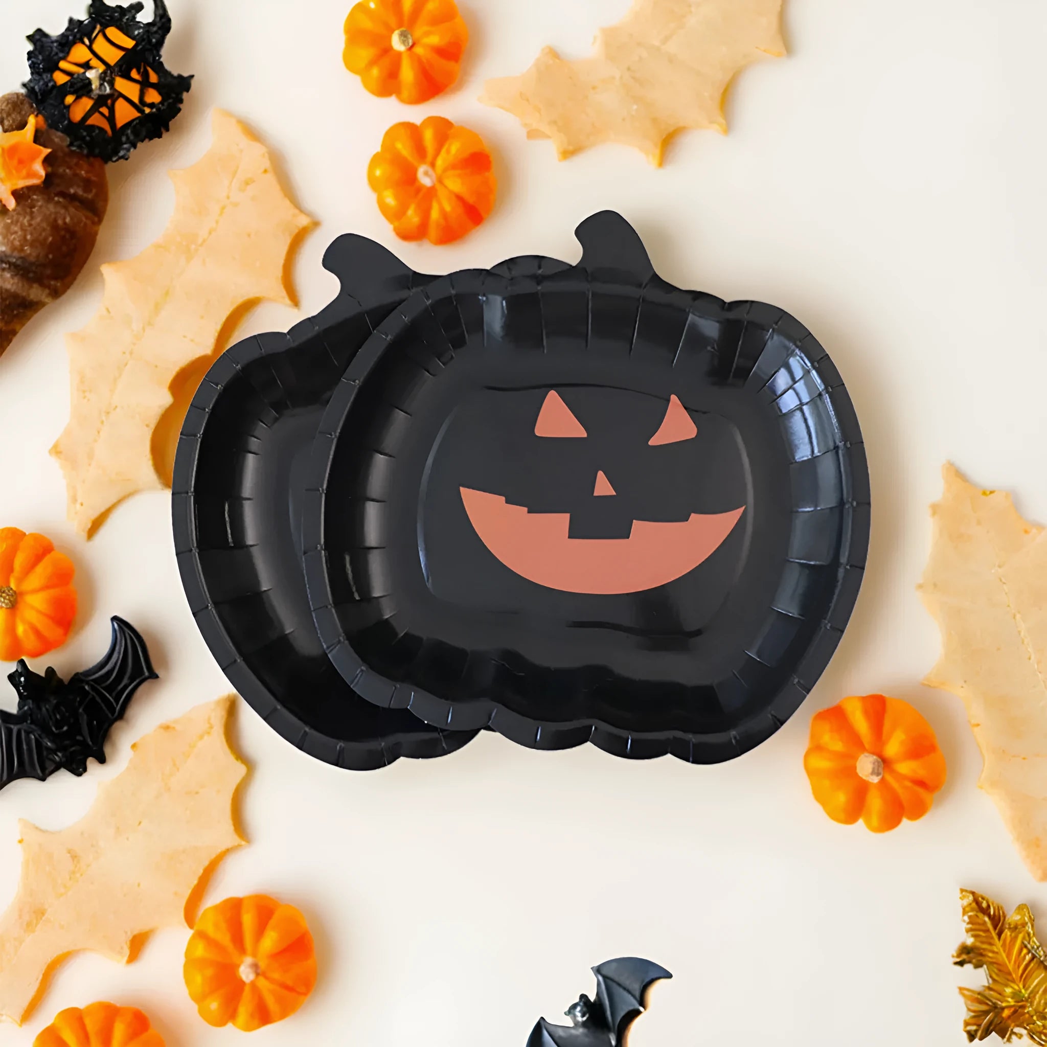 Black Halloween paper plates with pumpkin design measuring 9 inches diameter